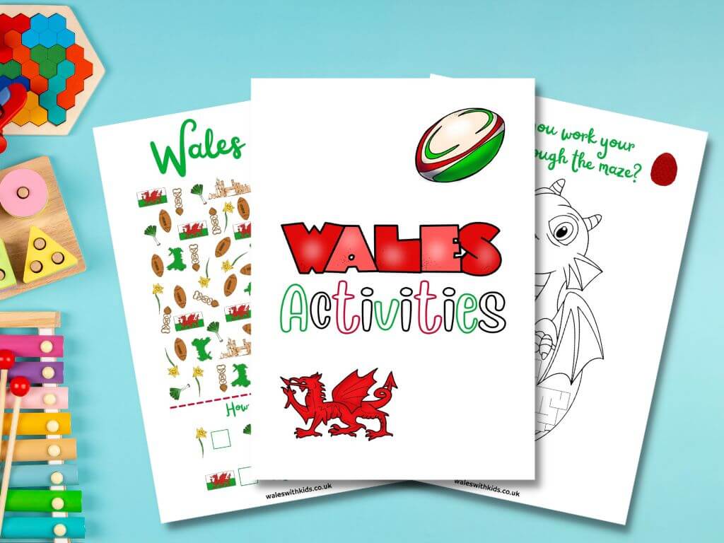 A flat lay picture of three pages from a Wales activity book for kids with toys to the left of the picture