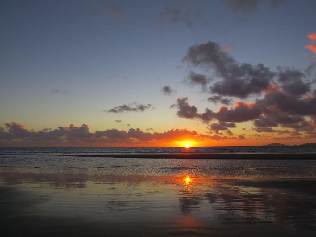 A picture of sunset from the beach at Porth Neigwl